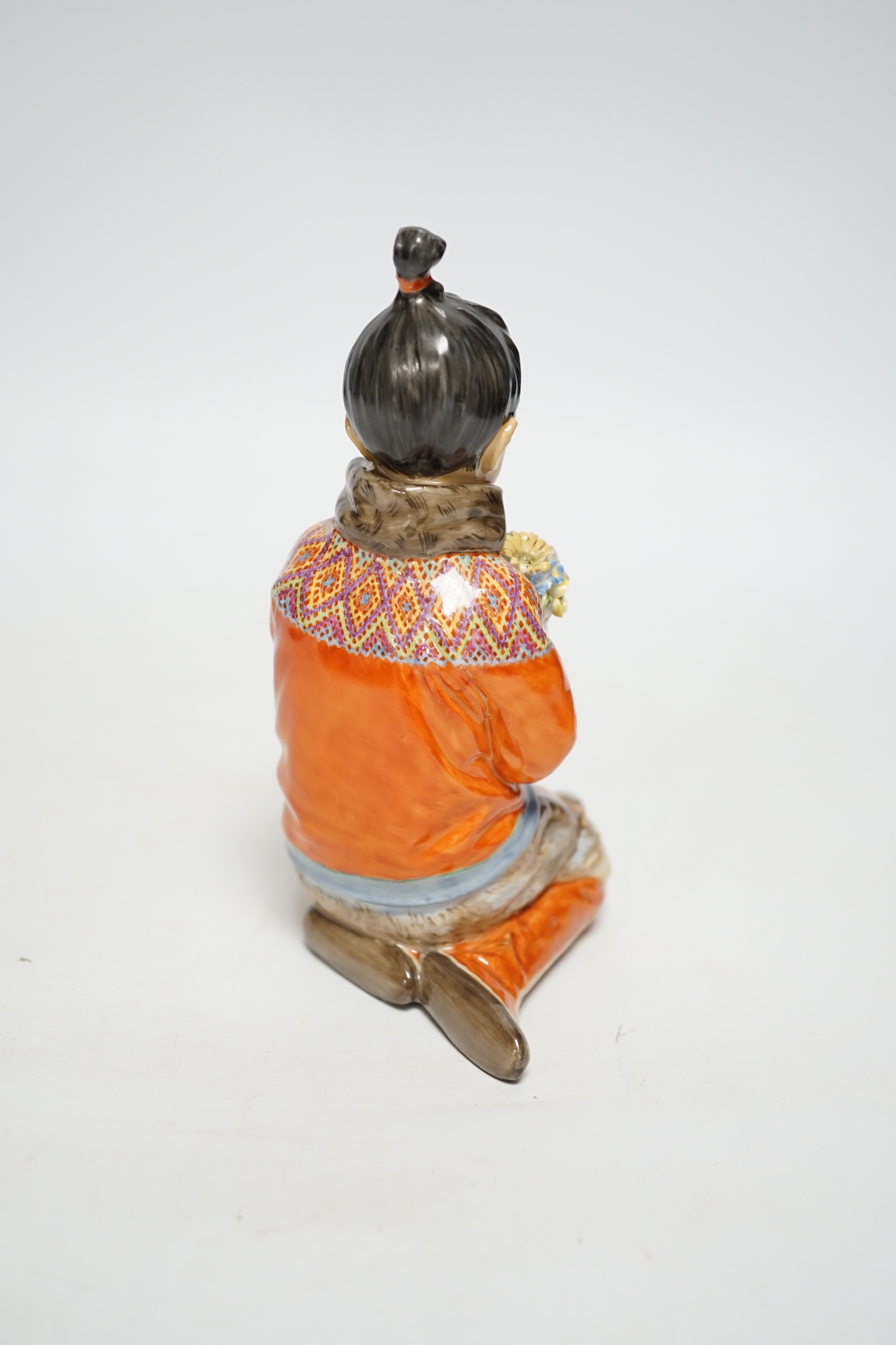 A Royal Copenhagen overglaze figure Greenlandic Girl, designed by Carl Martin-Hansen, National Costume Series, 15cm high